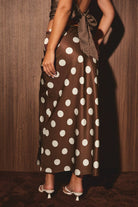 Mid-wisted polka dot bias skirt from LE LIS, featuring a flowing silhouette and classic black and white dot pattern.