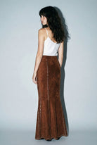 Skylar Rose suede studded maxi skirt shown in a stylish, flowing design with metal stud embellishments