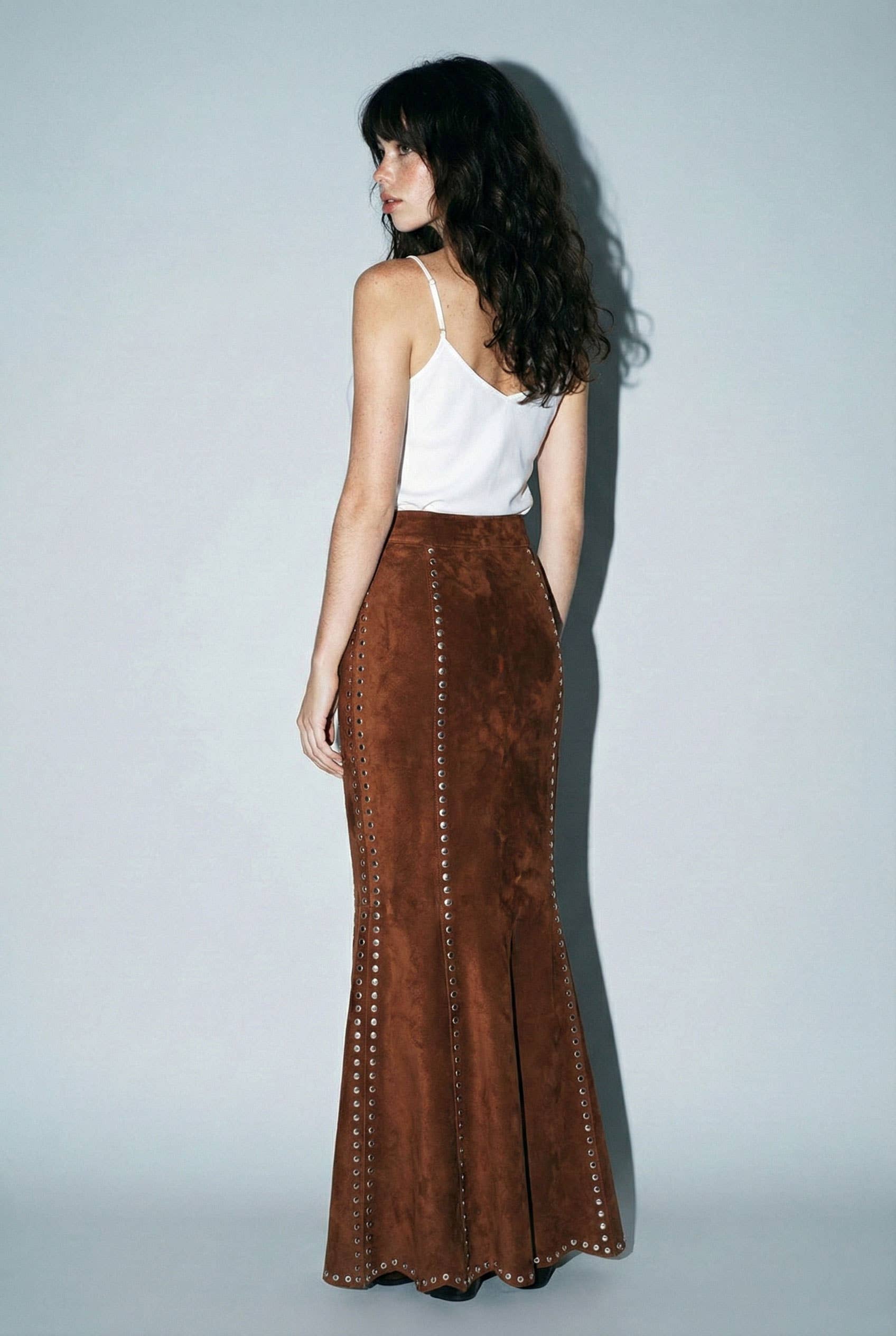 Skylar Rose suede studded maxi skirt shown in a stylish, flowing design with metal stud embellishments