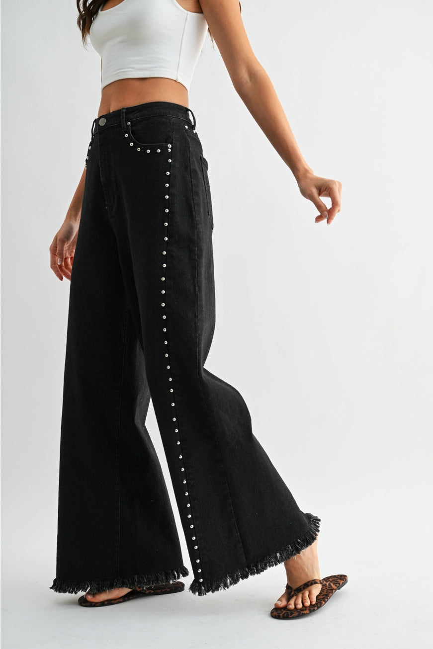 RARA Boutique studded ultra wide-leg washed jeans with distressed details and metal stud embellishments, casual and trendy denim.