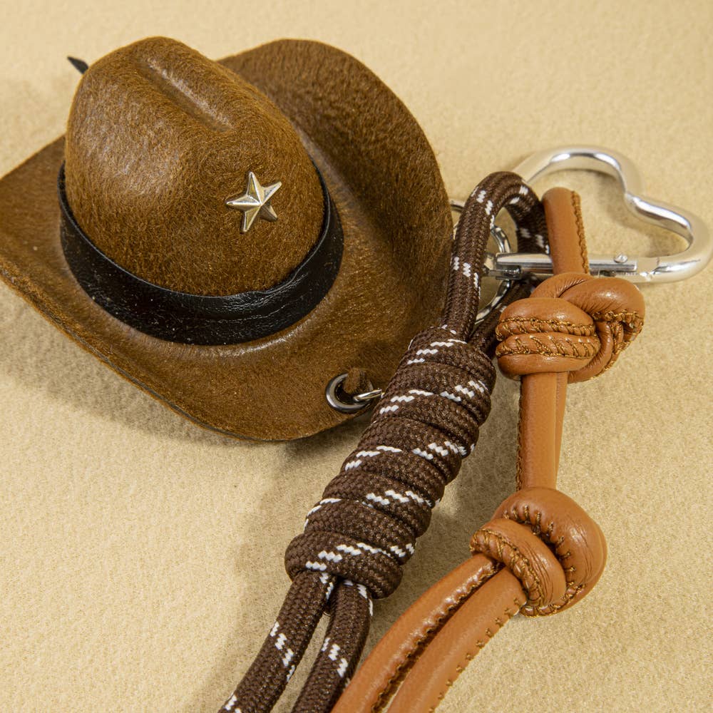 Mini cowboy hat Western rope bag charm from Collections by Fame Accessories featuring a small cowboy hat and rustic rope design.