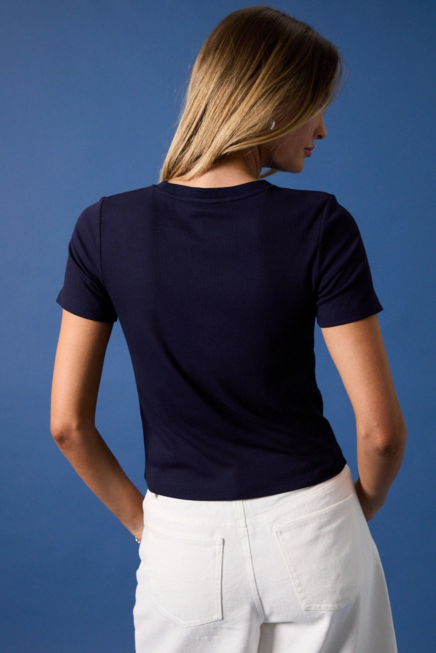 RARA Boutique embroidered American flag martini cocktail ribbed baby tee in white, featuring patriotic flag and cocktail design on front.