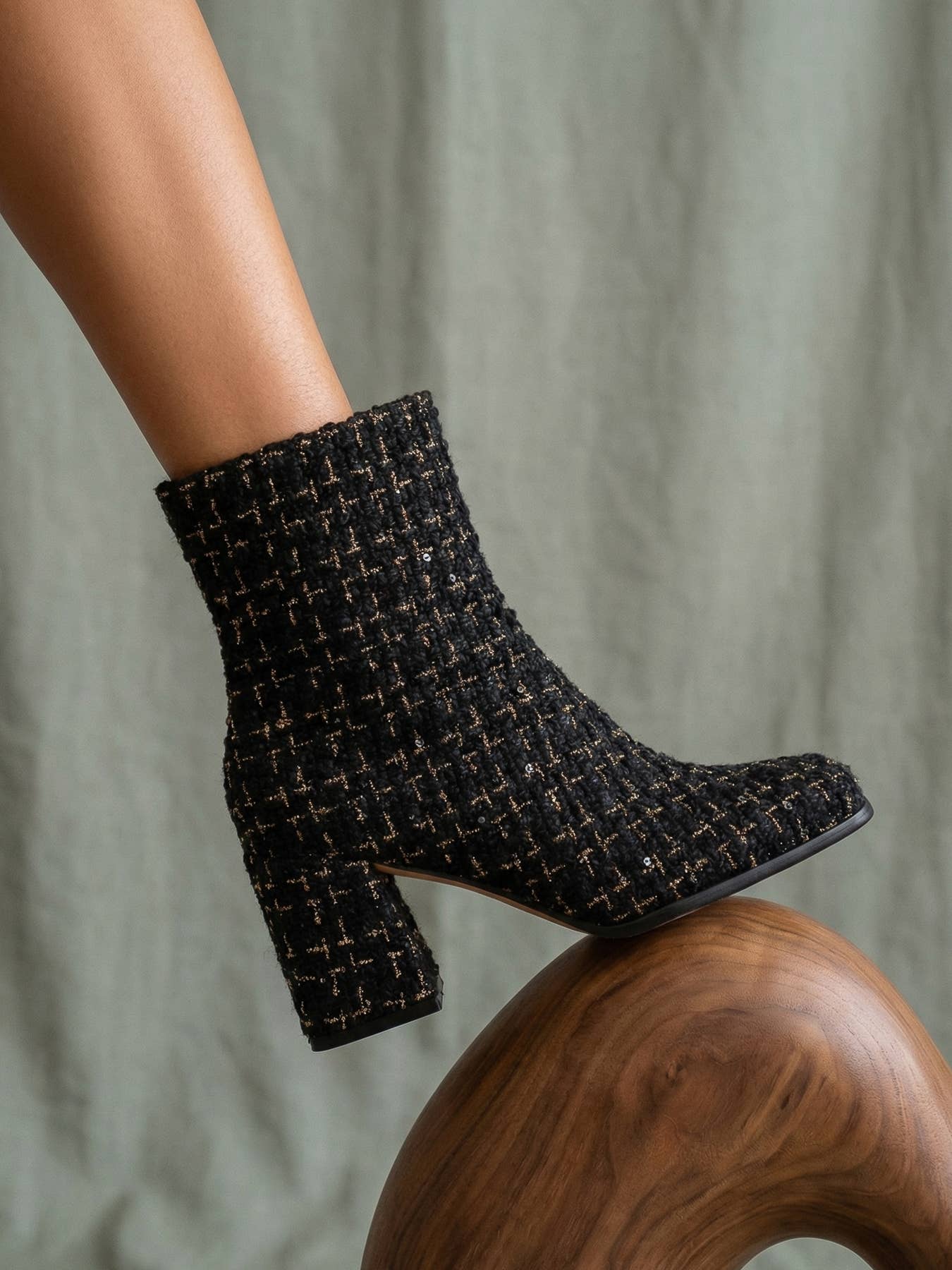 Black tweed woven block heel ankle fall boot from Oasis Society featuring a stylish design and sturdy heel.