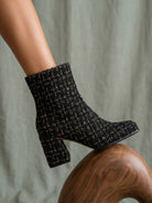 Black tweed woven block heel ankle fall boot from Oasis Society featuring a stylish design and sturdy heel.