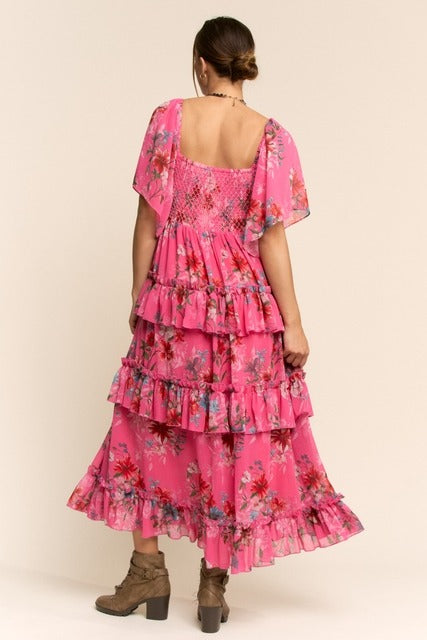 Floral tiered ruffle maxi dress with flutter sleeves from RARA Boutique, featuring a flowy silhouette and vibrant floral pattern.