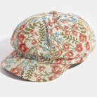 Floral tapestry newsboy cabbie hat by Collections by Fame Accessories, featuring a vintage-inspired floral fabric and classic newsboy design.
