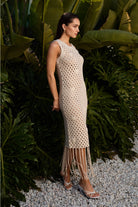Cowrie shell fringe open-knit dress by RARA Boutique featuring a flowing silhouette and bohemian style with shell accents.