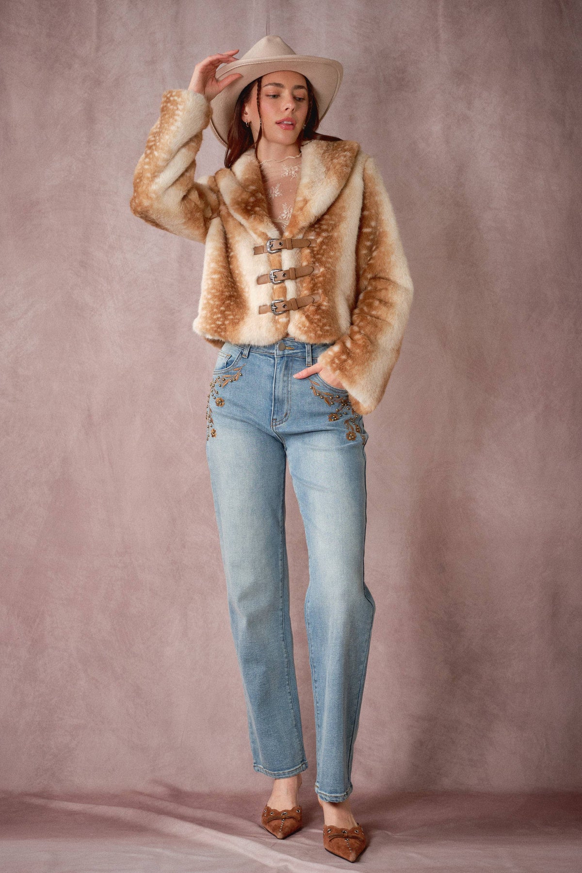 Blue B 25004J buckled faux fur jacket with deer print and buckle details, showcasing its stylish design and soft texture.
