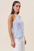 RARA Boutique seashell-embellished open-knit halter tank top with a stylish, breezy design, featuring seashell accents and open back style.