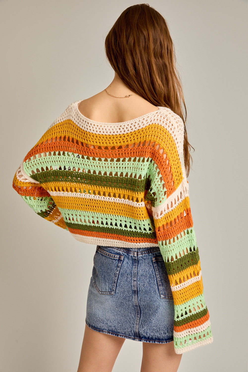 Multicolor striped crochet knit sweater top by RARA Boutique featuring orange, pink, and purple stripes, casual and stylish.