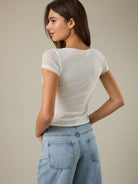 RARA Boutique boat neck floral graphic mesh blouse with semi-sheer fabric and feminine design, perfect for casual or dressy outfits.