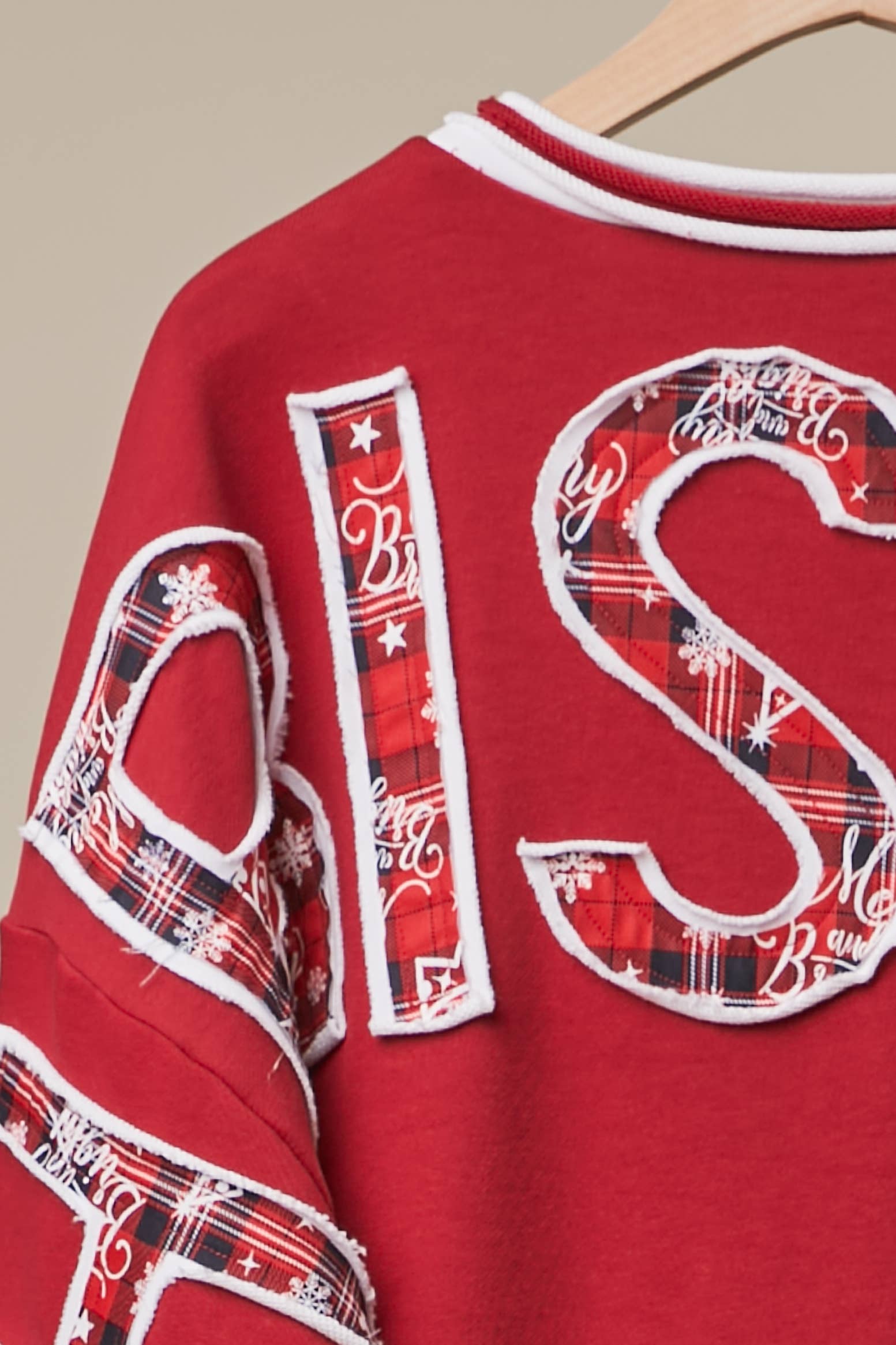 Mello Tuesday Holiday Merry Christmas letter sweatshirt featuring festive holiday design and cozy sweater fit.