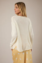 RARA Boutique Lemon Graphic lightweight knit sweater showing a vibrant yellow lemon design on soft fabric.