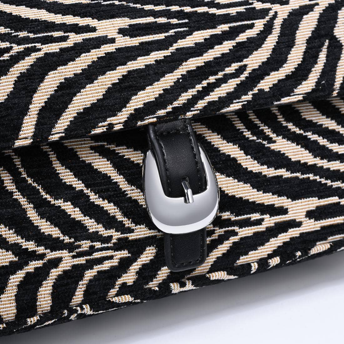 Urban Expressions Tuesday Gloria zebra shoulder bag with adjustable strap and stylish black and white zebra print.