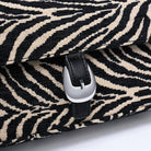 Urban Expressions Tuesday Gloria zebra shoulder bag with adjustable strap and stylish black and white zebra print.