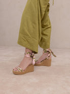 RARA Boutique Rose Garden floral espadrille wrap wedge sandals with colorful floral patterns and tan jute wedge heel.