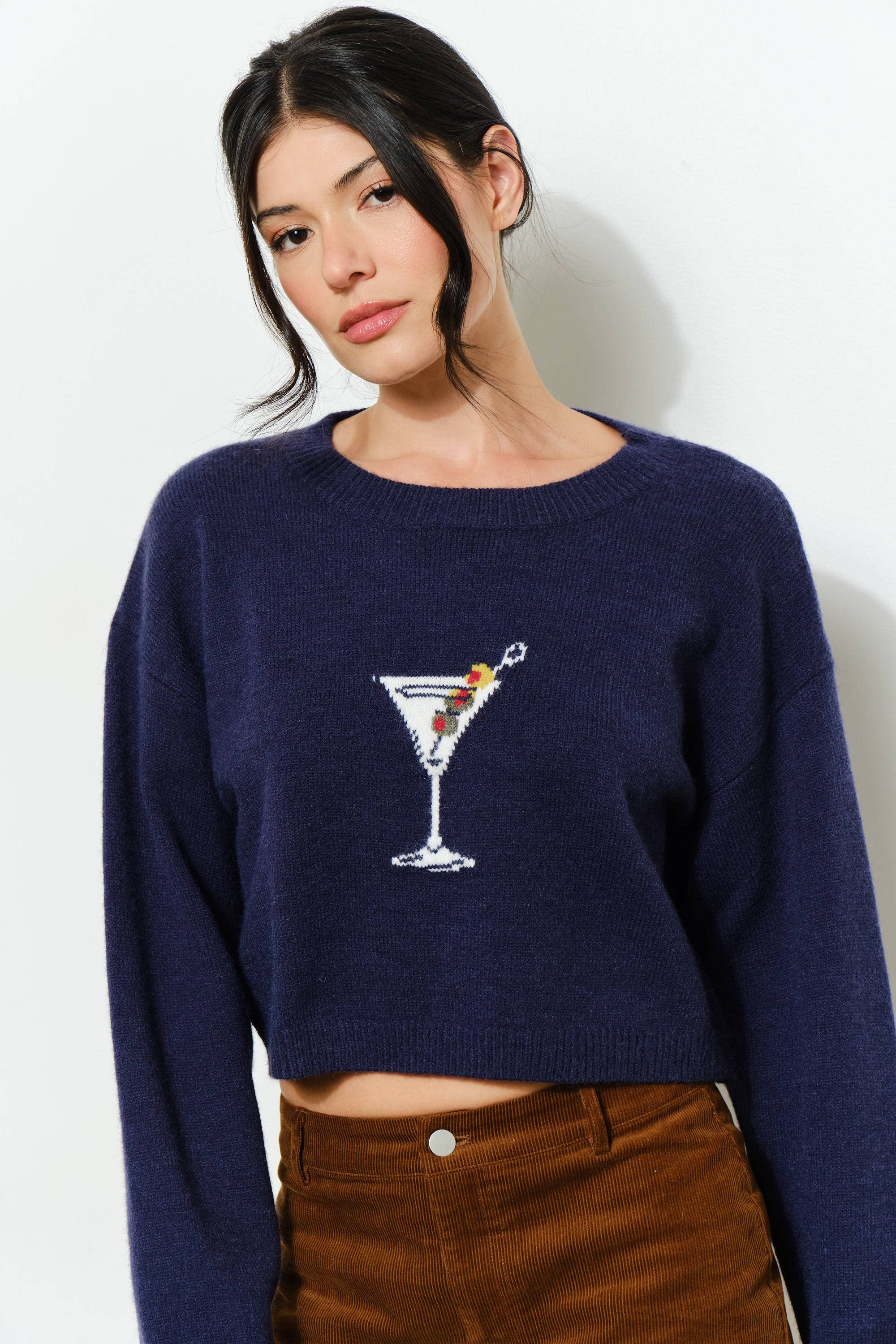 KAINA Martini sweater by Pretty Garbage, featuring a cozy knit texture in a stylish design, shown in a close-up view.