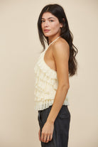 RARA Boutique tiered ruffle halter neck tank top with layered fabric and flowy design, displayed on a hanger.