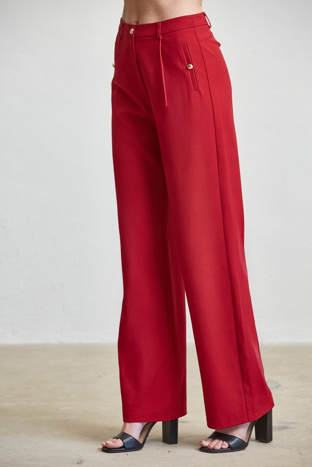 High waist tailored wide-leg trousers with button details from RARA Boutique, showcasing their stylish fit and sophisticated design.