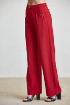 High waist tailored wide-leg trousers with button details from RARA Boutique, showcasing their stylish fit and sophisticated design.