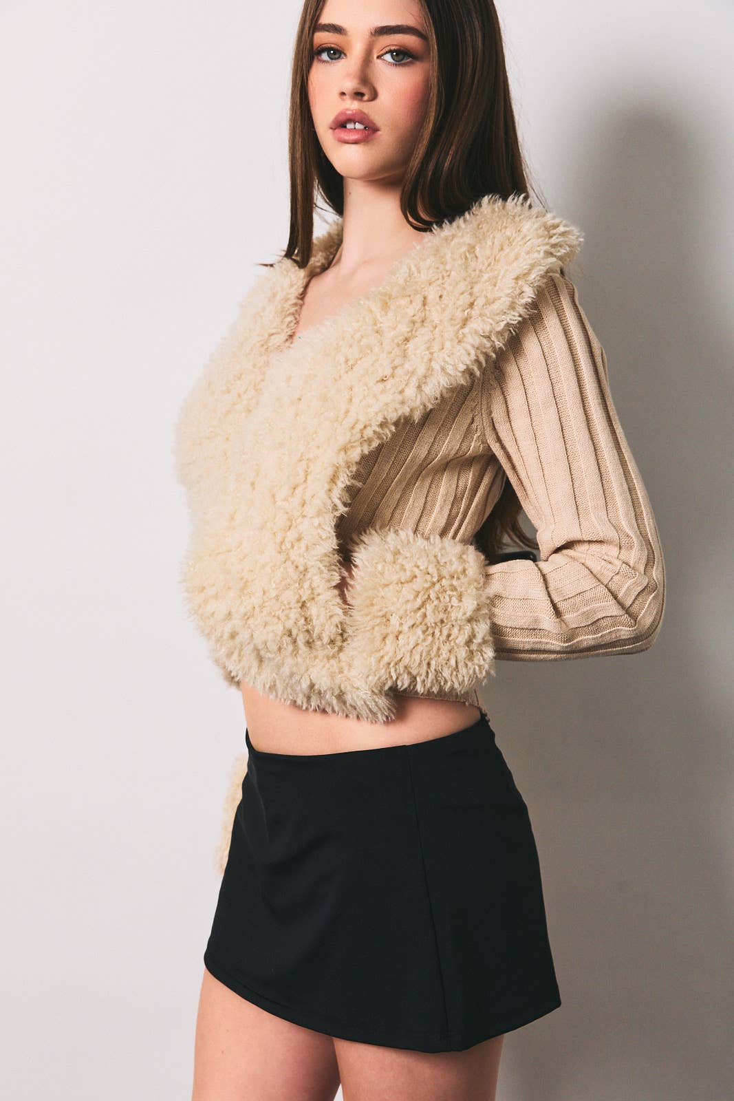 Long sleeve V-neck fur sweater rib jacket by LE LIS, featuring plush fur texture and ribbed knit design, displayed on a hanger.