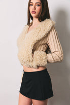 Long sleeve V-neck fur sweater rib jacket by LE LIS, featuring plush fur texture and ribbed knit design, displayed on a hanger.