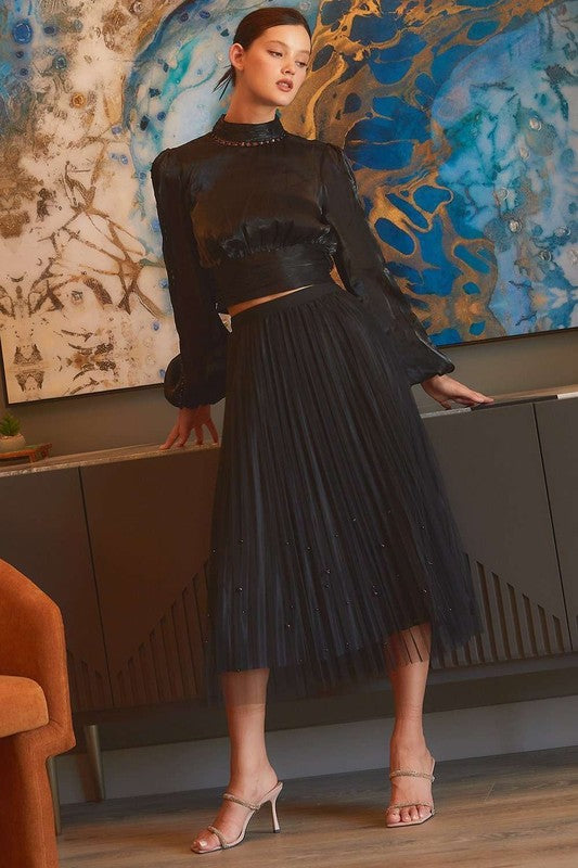 Pearl-embellished pleated mesh midi skirt by RARA Boutique, featuring a stylish design with intricate pearl details.