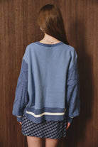 Le Lis sweatshirt with knit sweater sleeve, casual long-sleeve top featuring contrasting knit accents and a comfortable fit.