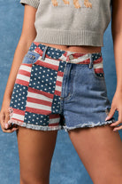 American flag patchwork denim shorts by Le Lis featuring distressed details and frayed hems, styled with casual summer wear.