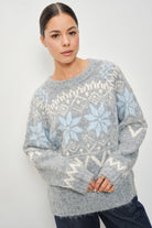 Pretty Garbage RIA Faire Isle crewneck knitted pullover with intricate cable patterns in soft, cozy fabric.