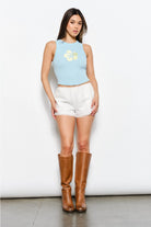 Embroidered hibiscus flower ribbed tank top by RARA Boutique featuring colorful floral embroidery and a fitted sleeveless design.