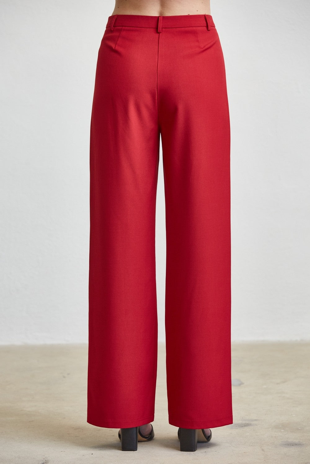 RARA Boutique high waist tailored wide leg trousers with button details, showcasing the elegant fit and sophisticated style.