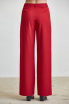 RARA Boutique high waist tailored wide leg trousers with button details, showcasing the elegant fit and sophisticated style.