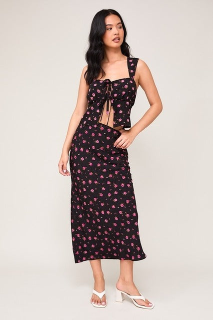 High waisted floral rose printed bias midi skirt by RARA Boutique, featuring colorful rose patterns and a flowy, elegant design.