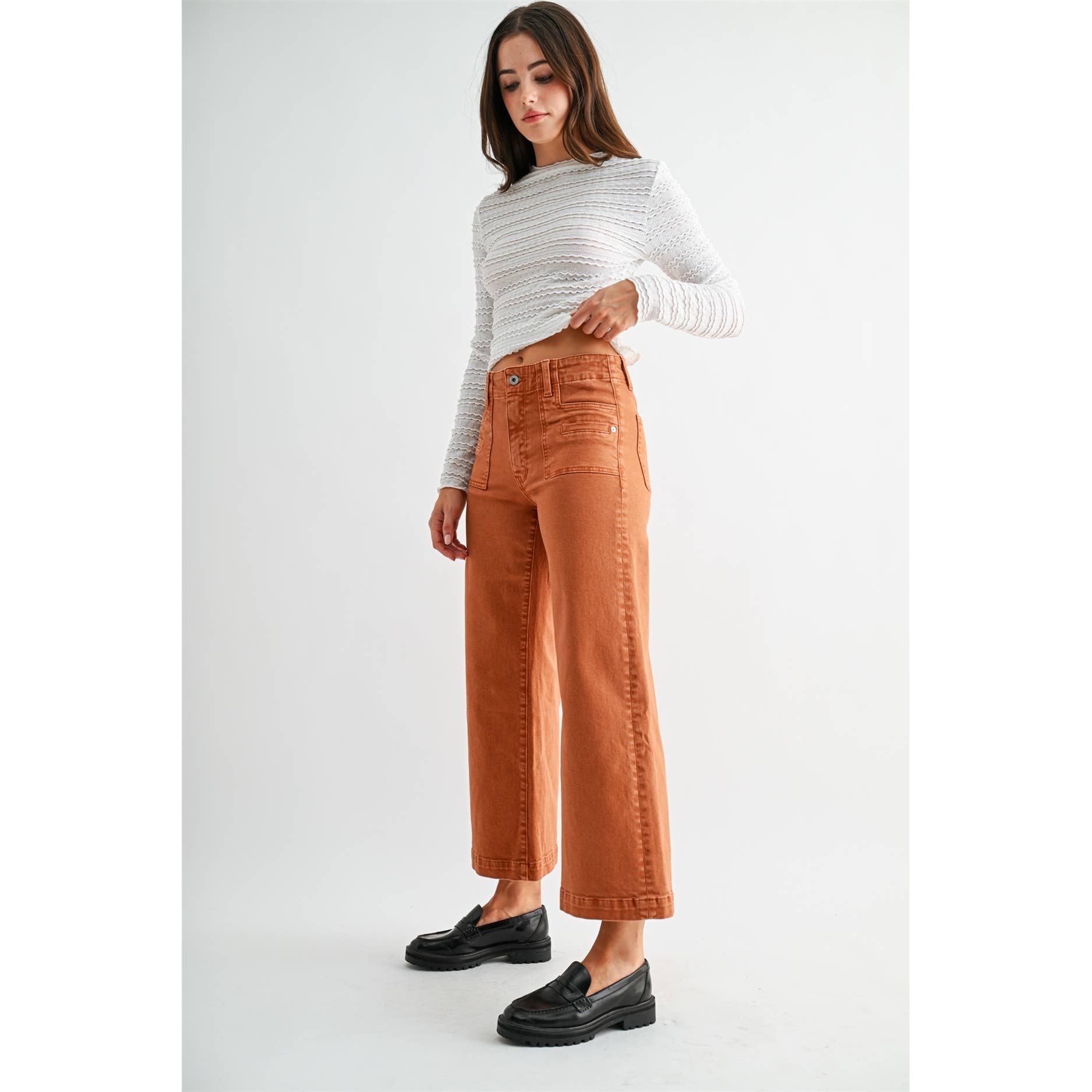 Mica Denim high-rise wide crop jeans with patch pockets, showcasing the denim fabric and stylish cut.