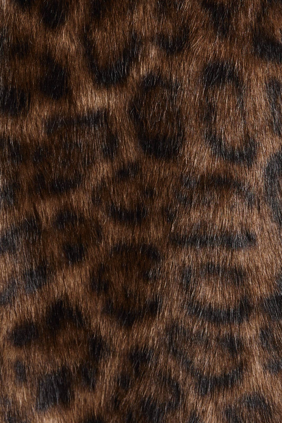 Le Lis faux fur long coat jacket displayed on a model, showcasing plush texture and stylish design.