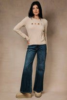 Round neck long sleeve ribbed top with fall-themed embroidery by Sunday Edition, featuring a cozy fall-inspired design and textured fabric.