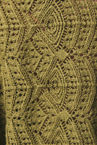 Long sleeve crochet cardigan by LE LIS featuring intricate knit patterns and a relaxed fit, displayed on a neutral background.