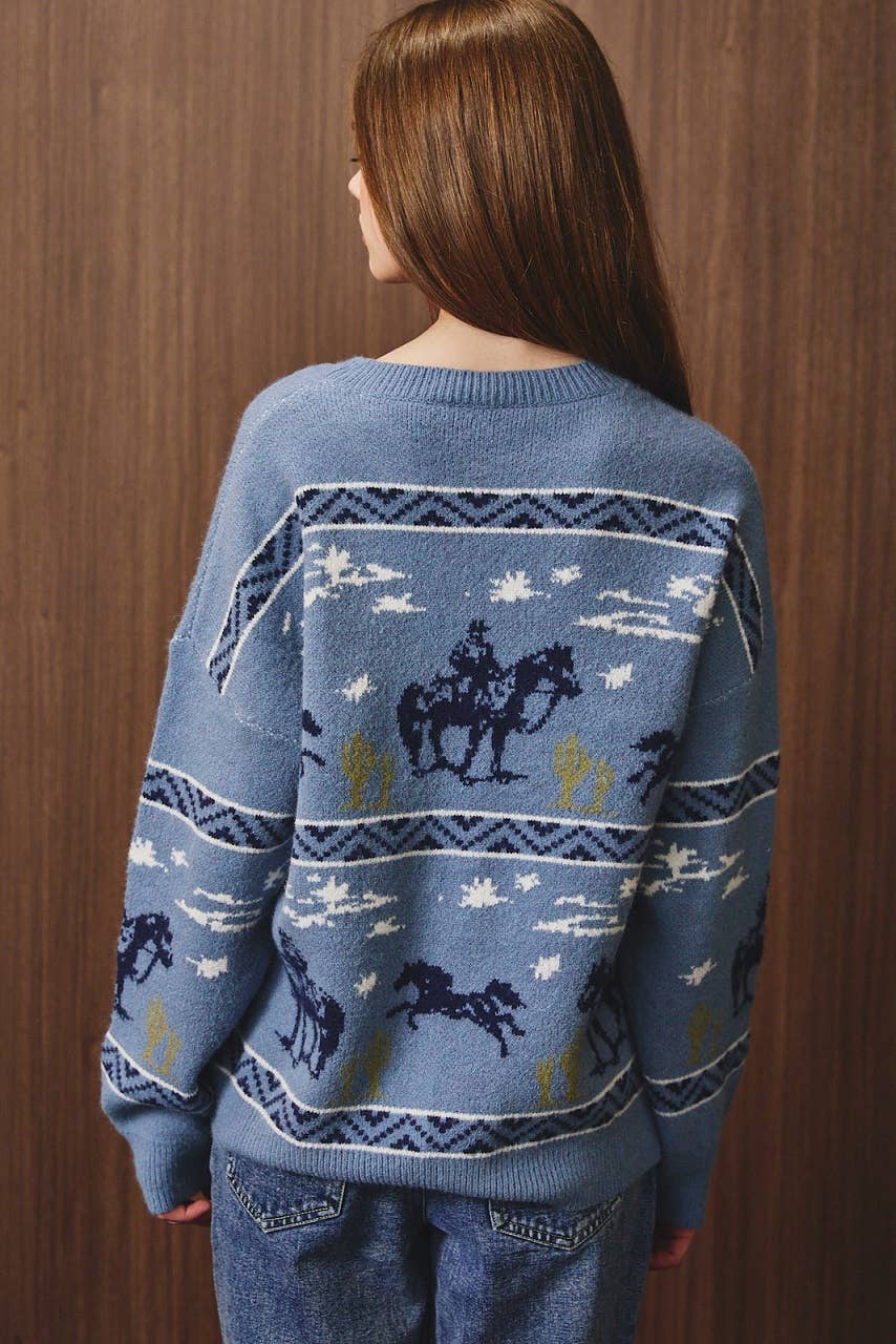 LE LIS cowboy graphic long sleeve crew neck sweater featuring a western-inspired design and comfortable knit fabric.