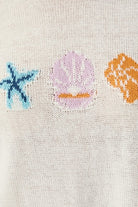 RARA Boutique Coastal Seashell lightweight knit sweater with sea-inspired design, soft fabric, and casual fit.