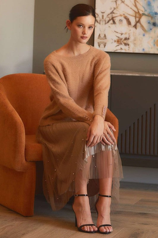Pearl-embellished pleated mesh midi skirt from RARA Boutique, featuring a flowing design and elegant detailing.
