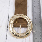 Suede hammered round buckle belt from Collections by Fame Accessories, featuring a textured leather strap and a round metal buckle.