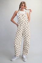 RARA Boutique polka dot barrel leg denim overalls with mineral washed finish, featuring adjustable straps and classic pocket design.