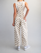 Mineral washed denim overalls with polka dot pattern and barrel legs from RARA Boutique, styled on a model.