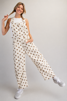 Mineral washed denim overalls with polka dot pattern and barrel leg style from RARA Boutique, featuring adjustable shoulder straps.