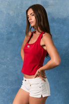 Red halter neck tank top with embroidered American flag patch from Le Lis, featuring a stylish and casual design.